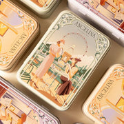 Selection of Angelina illustrated metal tins displayed on a neutral background, showcasing the brand’s iconic Art Deco–inspired designs.