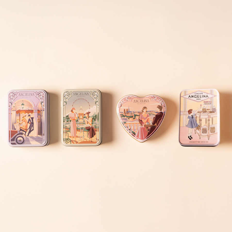 Four illustrated Angelina confectionery tins arranged in a row on a soft beige background.