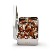 An open Angelina tin filled with individually wrapped caramel candies.